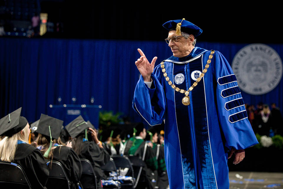 President Fred P. Pestello, Ph.D., leaves Chaifetz Arena after Commencement on May 18, 2024. Photo by Sarah Conroy.