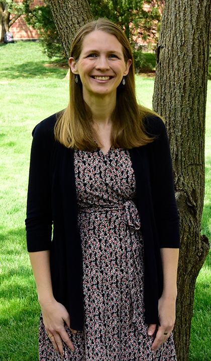 christina garcia poses on slu's beautiful campus