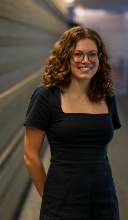 A female student wearing glasses smiles A female student wearing glasses smiles