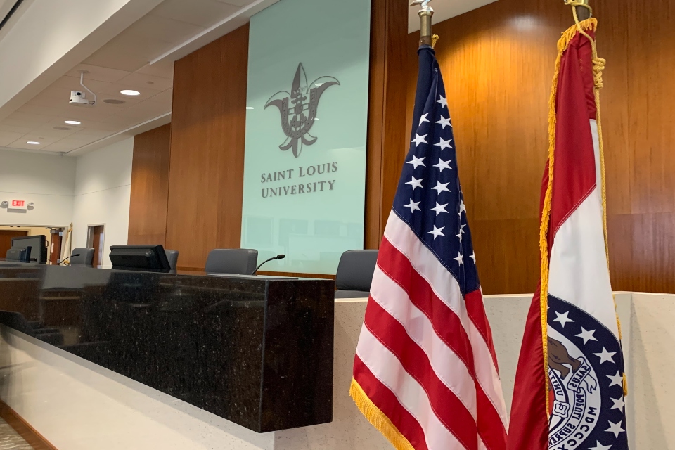 courtroom with flags