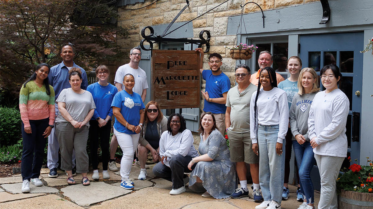 A group photo of the Career Services team posing in front of Pere Marquette Lodge in Grafton, IL. 