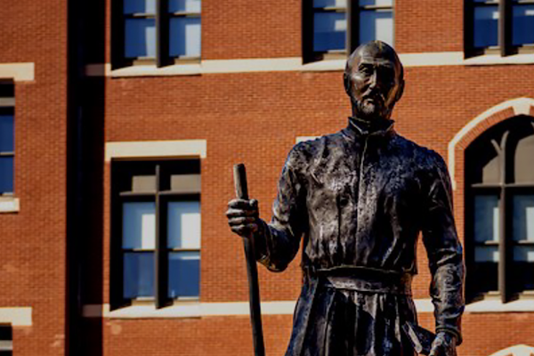 A statue of Saint Ignatius in the Quad at SLU.