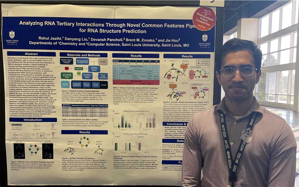 a man stands in front of a poster