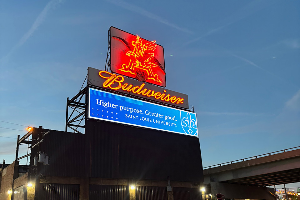 A vibrant neon sign featuring a striking red eagle illuminating the surrounding area with its bold colors.