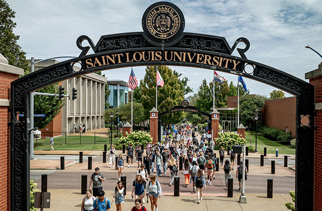 Aerial shot of students walking under SLU arches Aerial shot of students walking under SLU arches