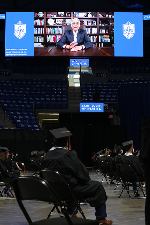 Pestello appears onscreen at a socially distanced precommencement ceremony in May 2021 at Chaifetz Arena. 
